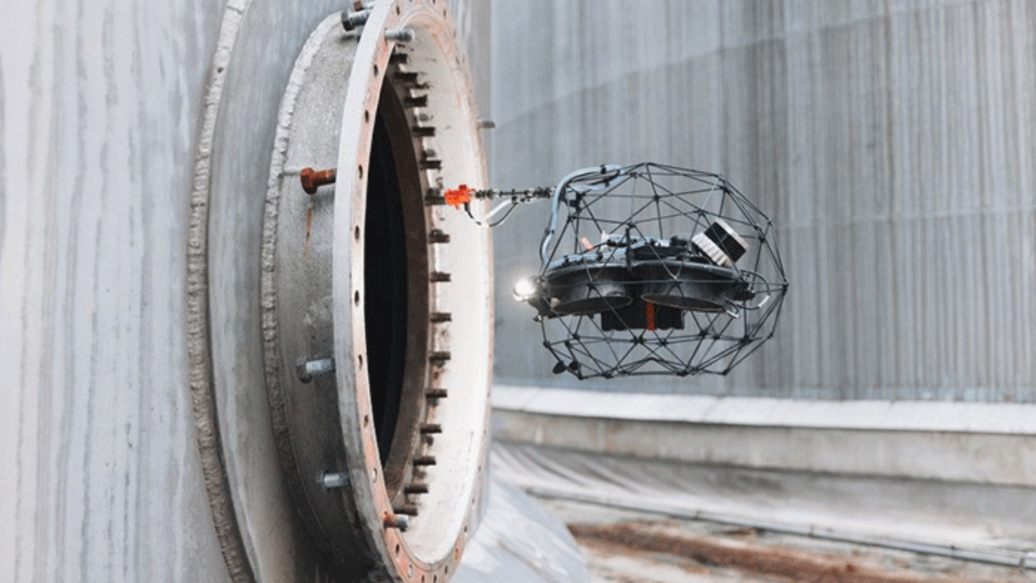 Elios 3 drone inspecting a large cylindrical industrial component.