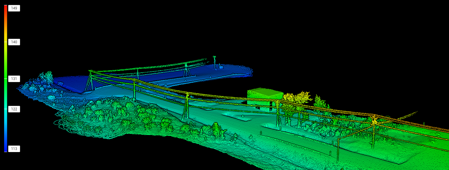 3D scan of a landscape with electrical poles and surrounding area.